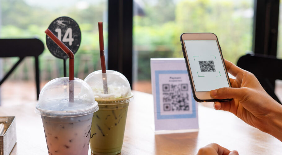 womens hands are using phone scan qr code select food menu in china