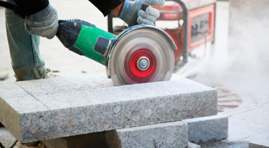 worker with angle grinder