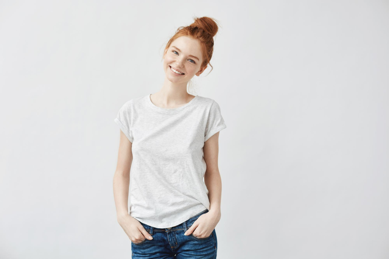 young attractive redhead girl smiling looking camera isolated white