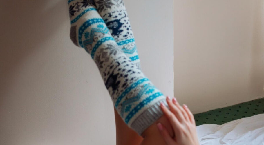 young beautiful woman warm handmade knitted clothes home autumn gaiters knee socks leggings