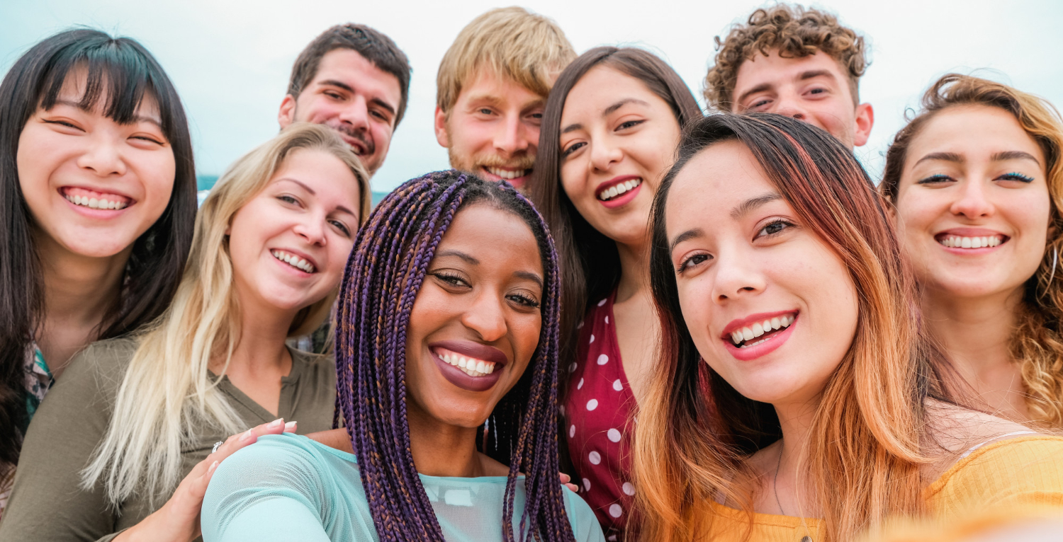 young friends from diverse cultures races taking photo making happy faces friendship together