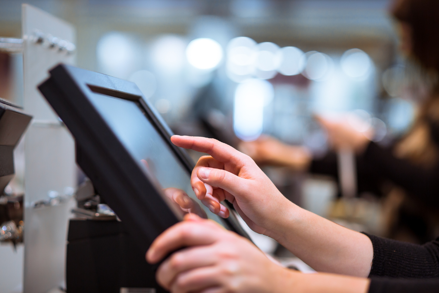 touchscreens kiosk display with young woman doing a job search process